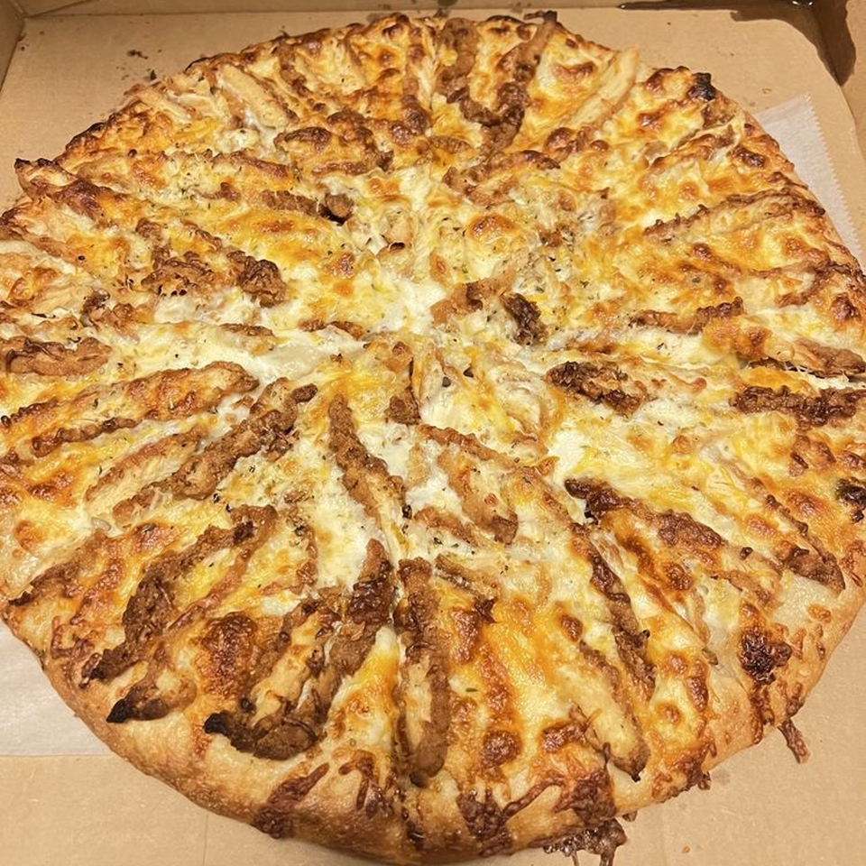 A whole Bozzy's Pizzeria pizza with melted cheese and crispy toppings in a cardboard box.